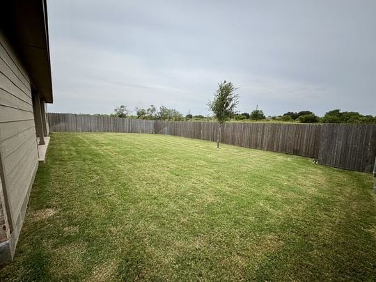Back Yard, weekly mow lawn service in Abilene, TX
